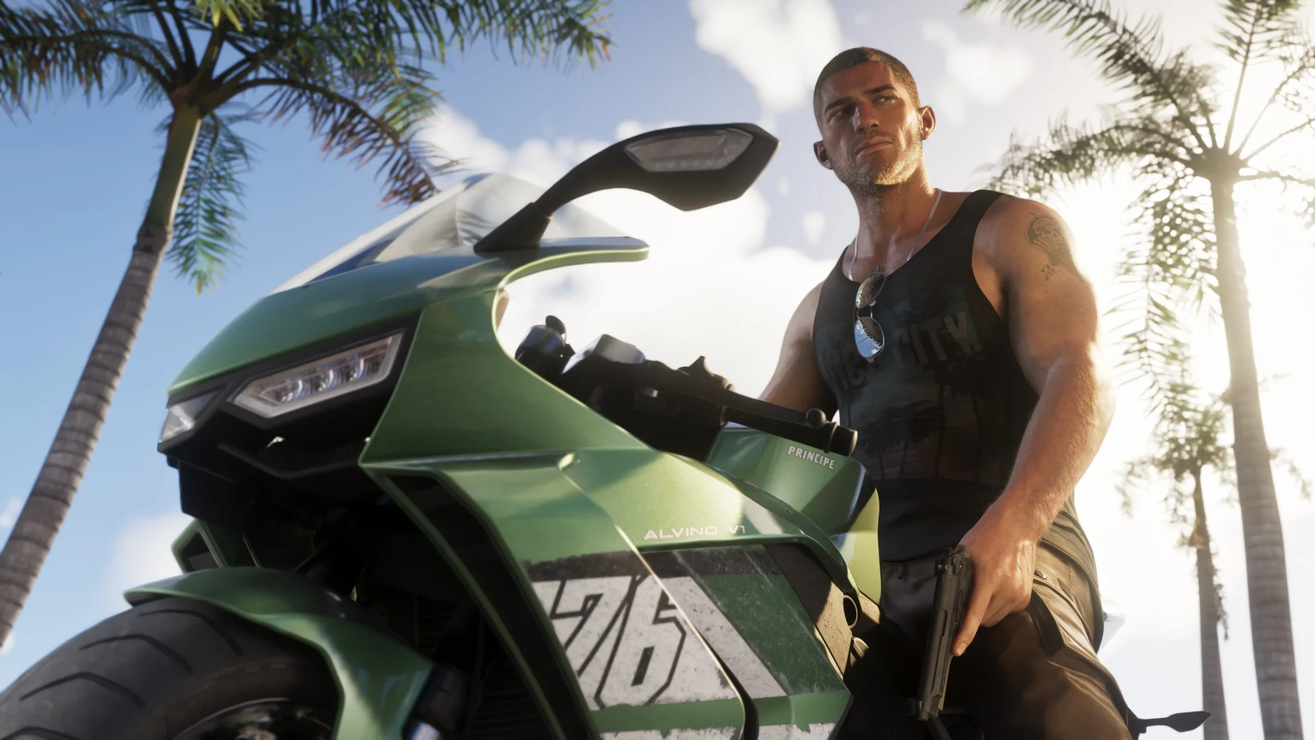 Jason Duval sitting on a green motorcycle while holding a handgun